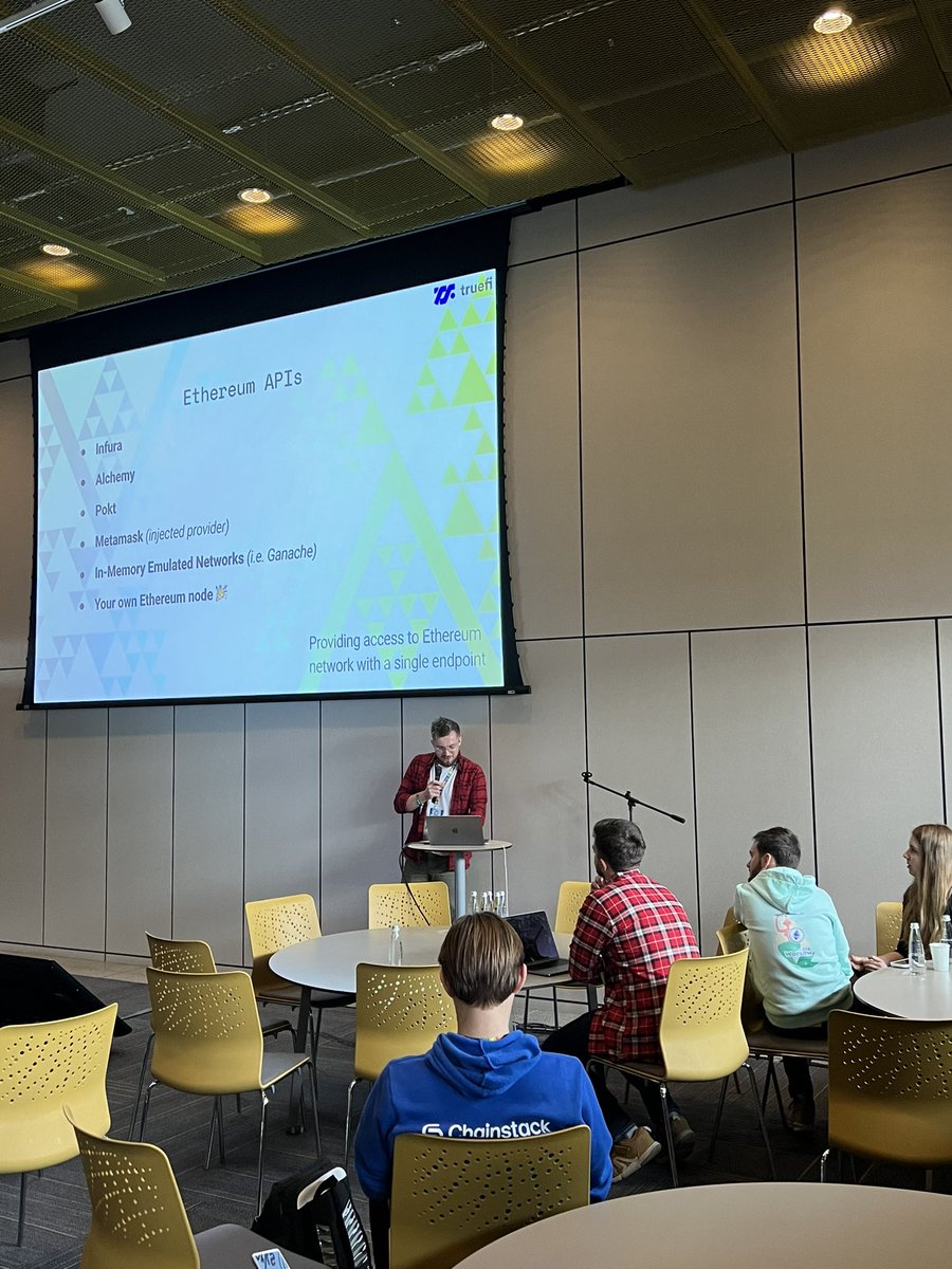 Our team is crushing it at #DevconBogota!
<a href="/barrutko/">barrutko.eth 🦦</a> running a smart contract testing workshop, onboarding new developers to Waffle in Workshop room 2 right now.