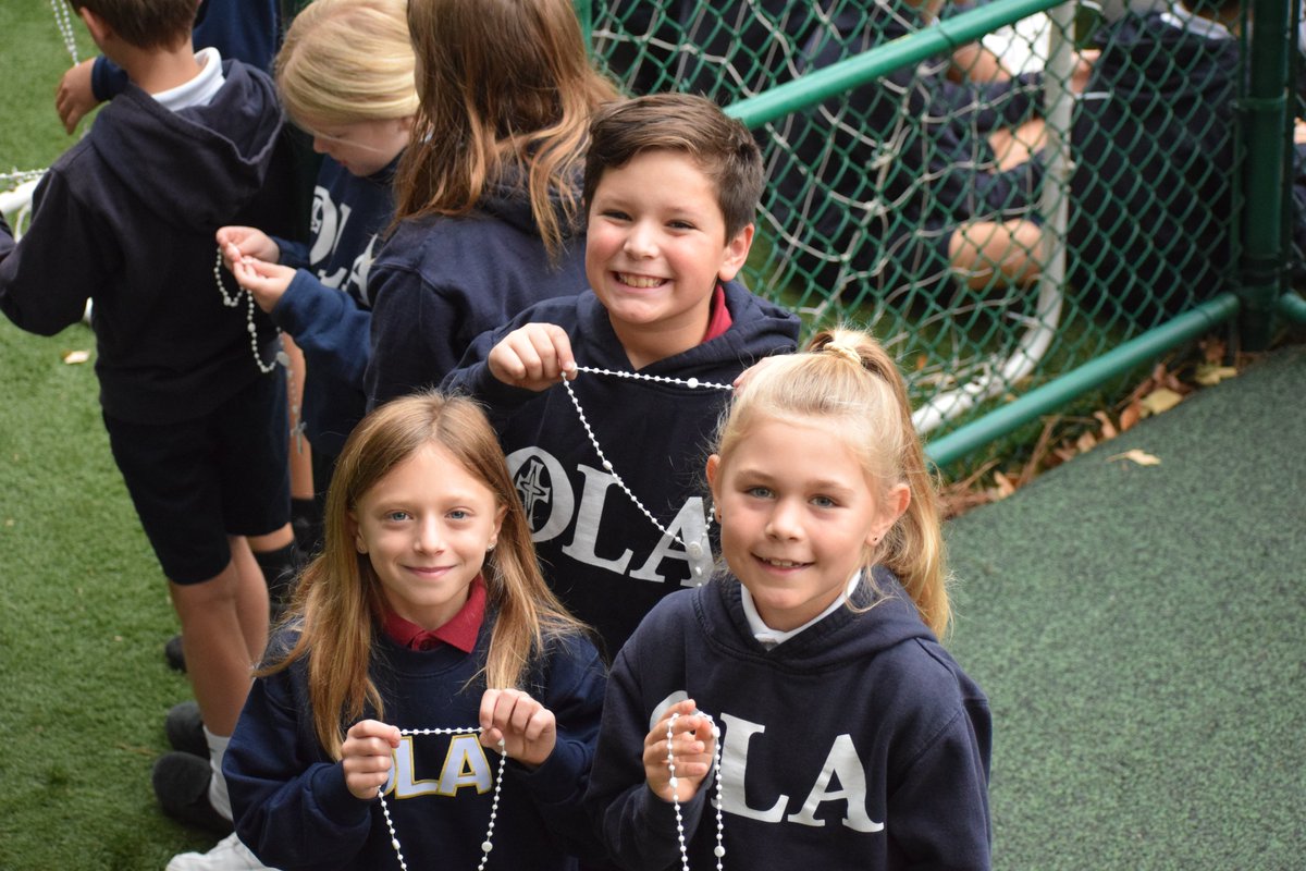 OLASchoolATL's tweet photo. The month of October is dedicated to the Rosary. Today OLA Catholic School participated in a living Rosary. Students served as beads and formed a Rosary on the field. It was a special way to pray the Rosary as a school community. https://t.co/vwL4qu22HL