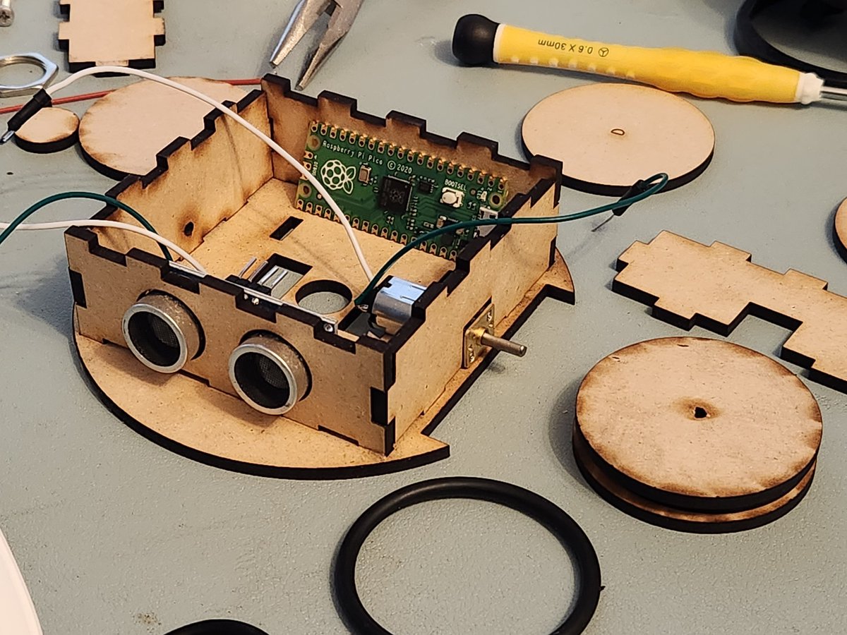 JerseyITGuy's tweet photo. Not a bad first play at a laser cut version of @kevsmac #burgerBot. Some tweaks on motor mounts and wooden o-ring wheels but I think this could be working this weekend if I don't run out of wood! https://t.co/WYihHKv29y