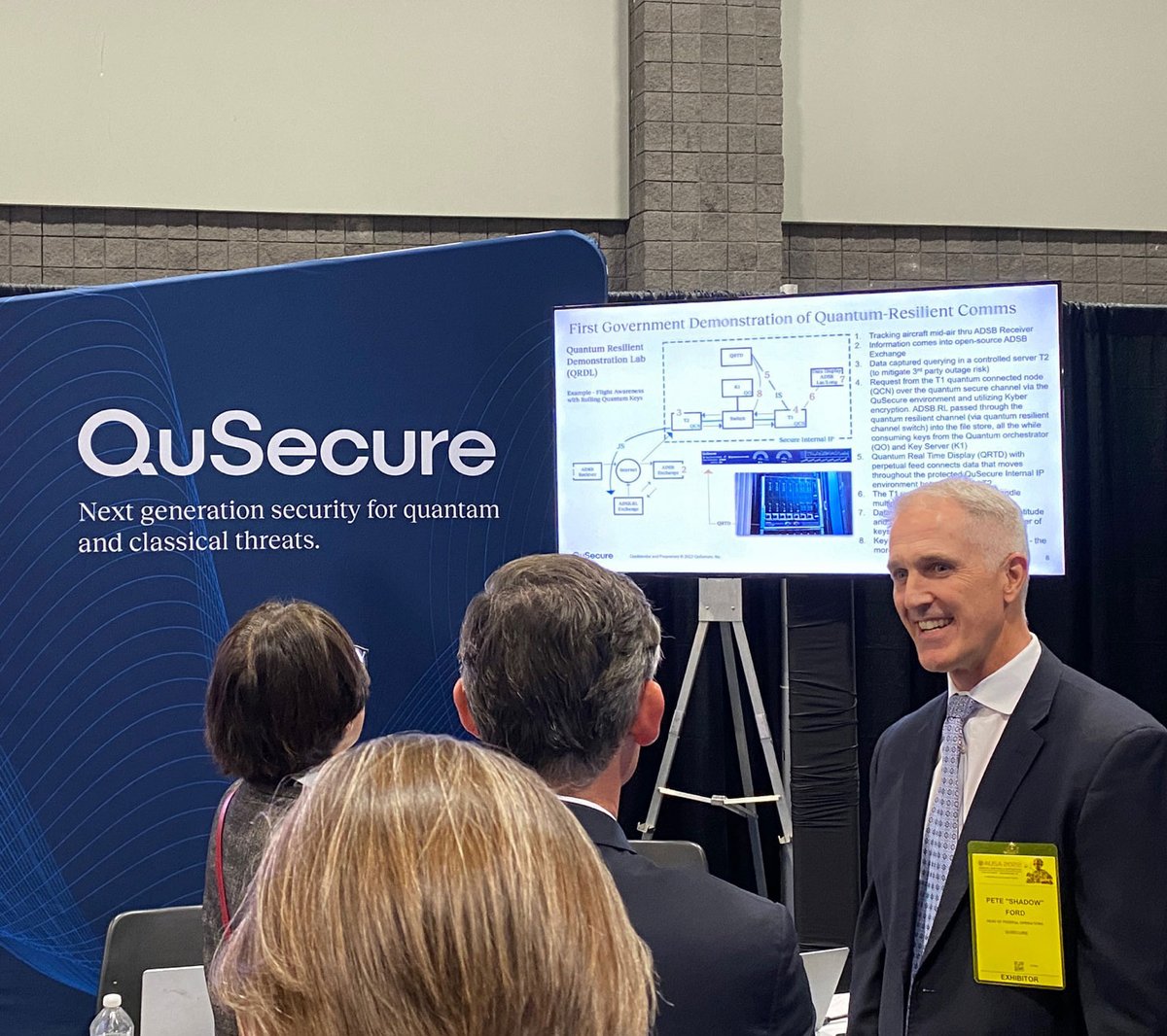 QuSecure's tweet photo. QuSecure's Federal Operations team, Pete Ford and Patrick Shore, were hard at work sharing our #QuProtect post #quantum #cybersecurity software solution at the @AUSA conference today.  Army officials came by to get the latest on our Quantum Resilient solution. 

#AUSA2022 https://t.co/x5YCVbv3iT