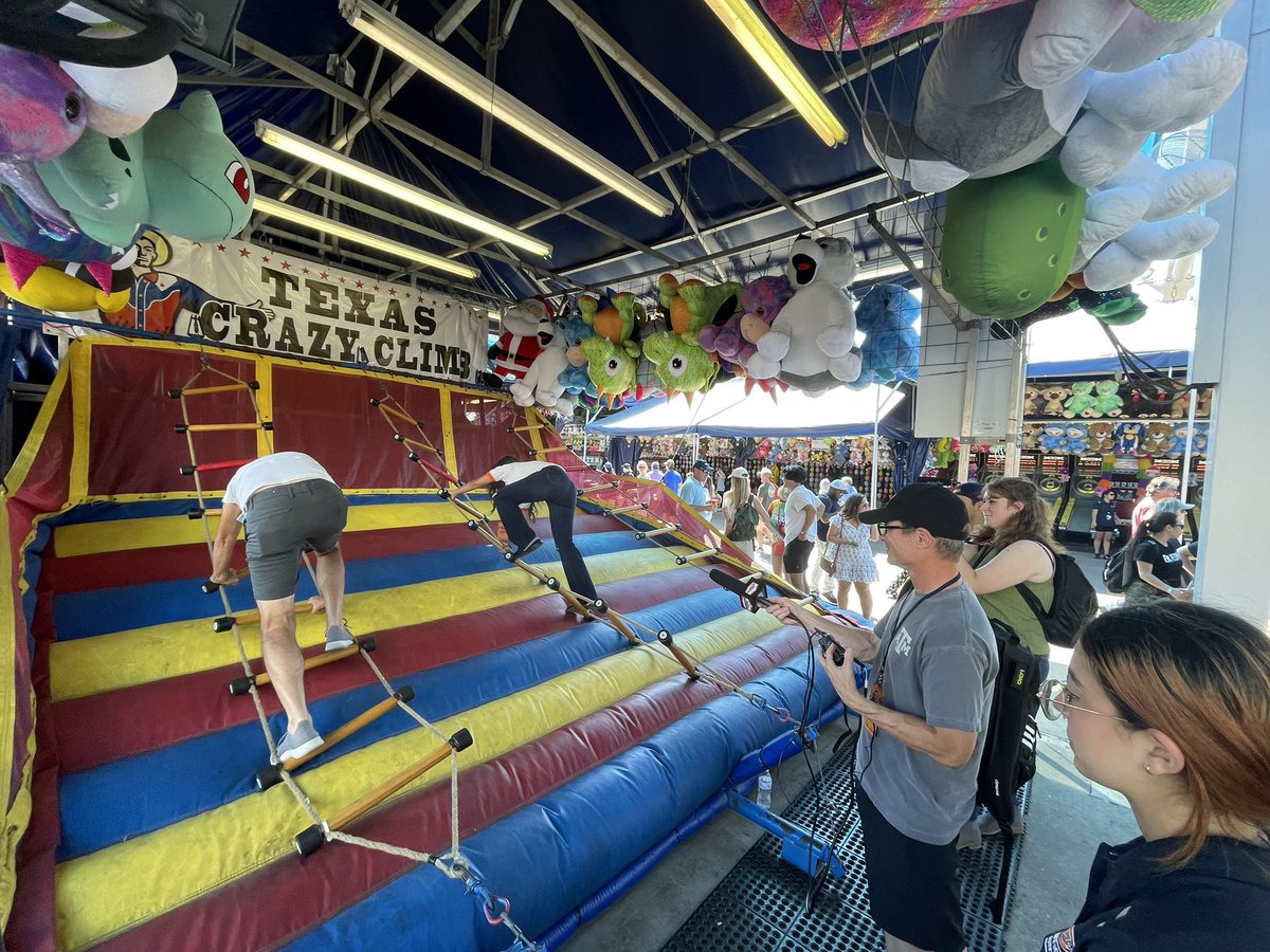 BigTexNews's tweet photo. Let the games begin! Fellow co-hosts @HawkeyeOnAir and @michrod from @963kscs battled it out in the @StateFairOfTX Midway Olympics today!🥇@Audacy https://t.co/vEv1exdXJL