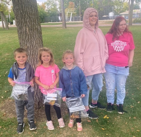 The  JK  class,  along with Mr. Hinker and Mrs. Shade's life skill class and high school mentor,  enjoyed a perfect fall day to take a walk and find different leaves to compare and count - they also took a quick break to enjoy the park.