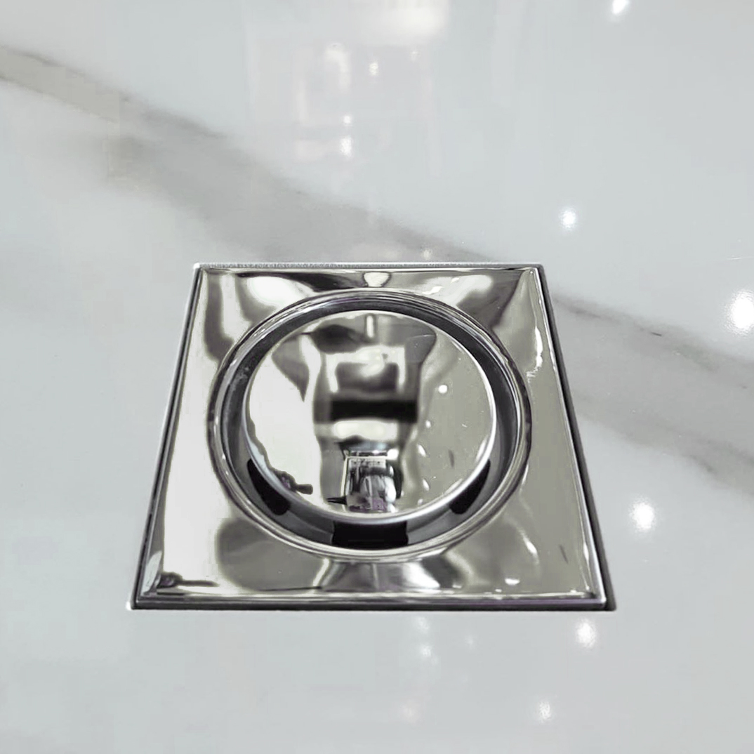 #Sumidero sifónico cuadrado de 115×115 mm con #reja de acabado pulido brillo fabricada en #aceroinoxidable, la parte central redonda es extraíble para facilitar su limpieza. El cuerpo es de PVC y la salida puede ser tanto horizontal como vertical.