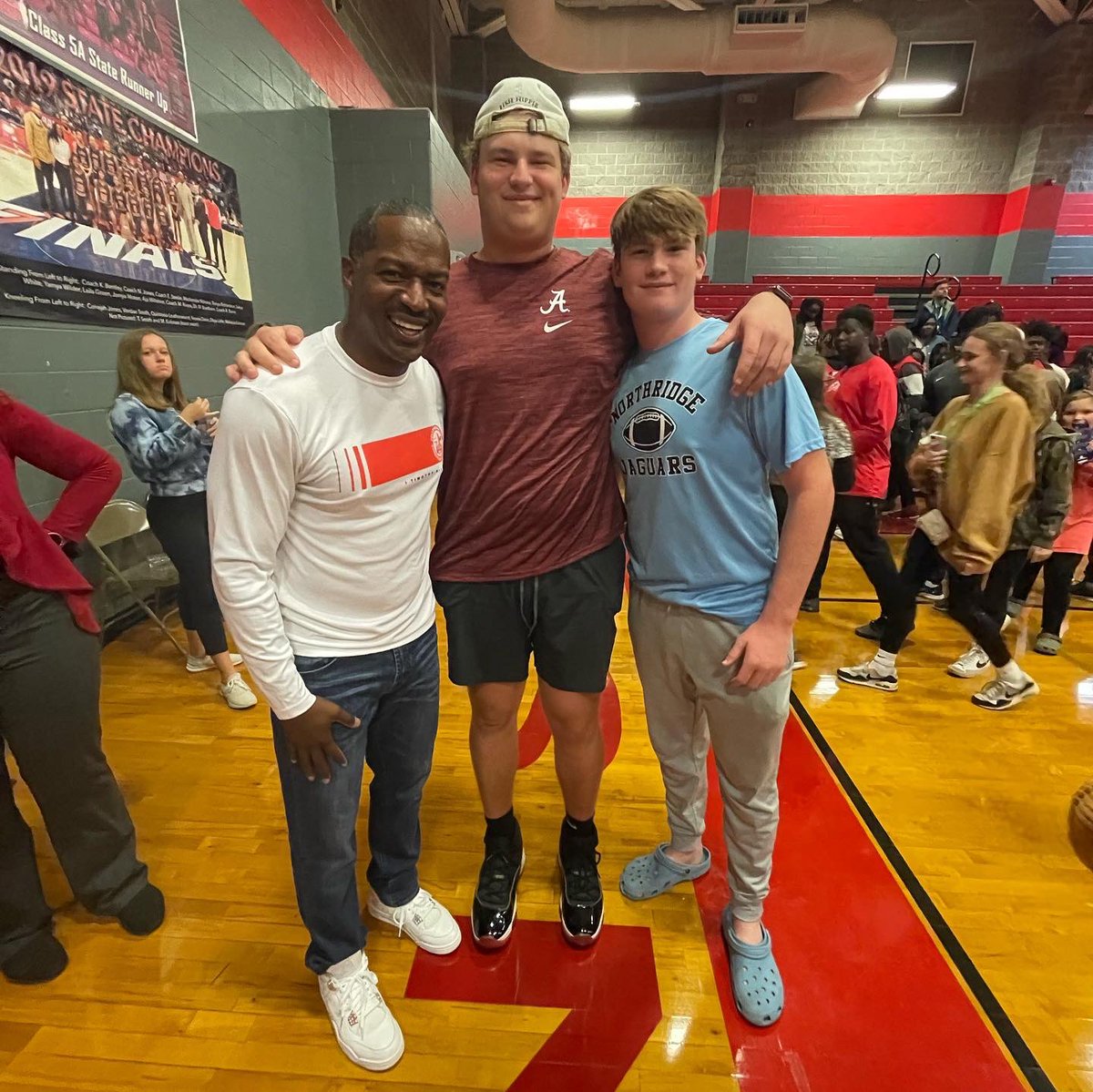 In Tuscaloosa, AL with new FCA state director Ryan Limbaugh, Alabama Football Chaplain Scotty Hollins, and University of Alabama Football commit Wilkin Formby. 
The most famous person there was Jesus! He saved some souls. The population of heaven was changed last night.