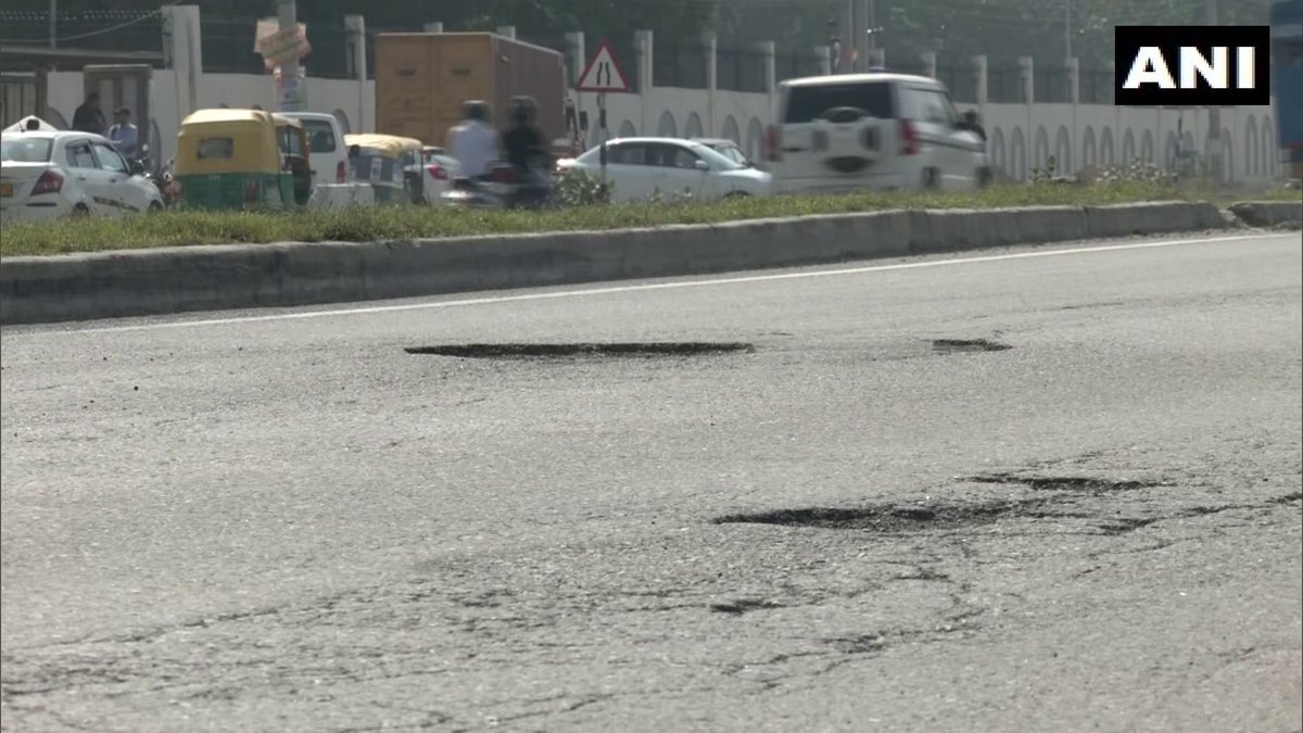 ANI's tweet photo. Haryana | Potholes &amp; craters seen on stretches of road on Delhi–Jaipur Highway (NH 48), visuals from Gurugram

A commuter says, "Some potholes are 2ft deep, and vehicles get damaged. Sometimes we face traffic, some times dust affects visibility. I request Govt to repair the road" https://t.co/HRGxUALtWr