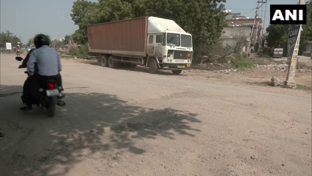 ANI's tweet photo. Haryana | Potholes &amp; craters seen on stretches of road on Delhi–Jaipur Highway (NH 48), visuals from Gurugram

A commuter says, "Some potholes are 2ft deep, and vehicles get damaged. Sometimes we face traffic, some times dust affects visibility. I request Govt to repair the road" https://t.co/HRGxUALtWr