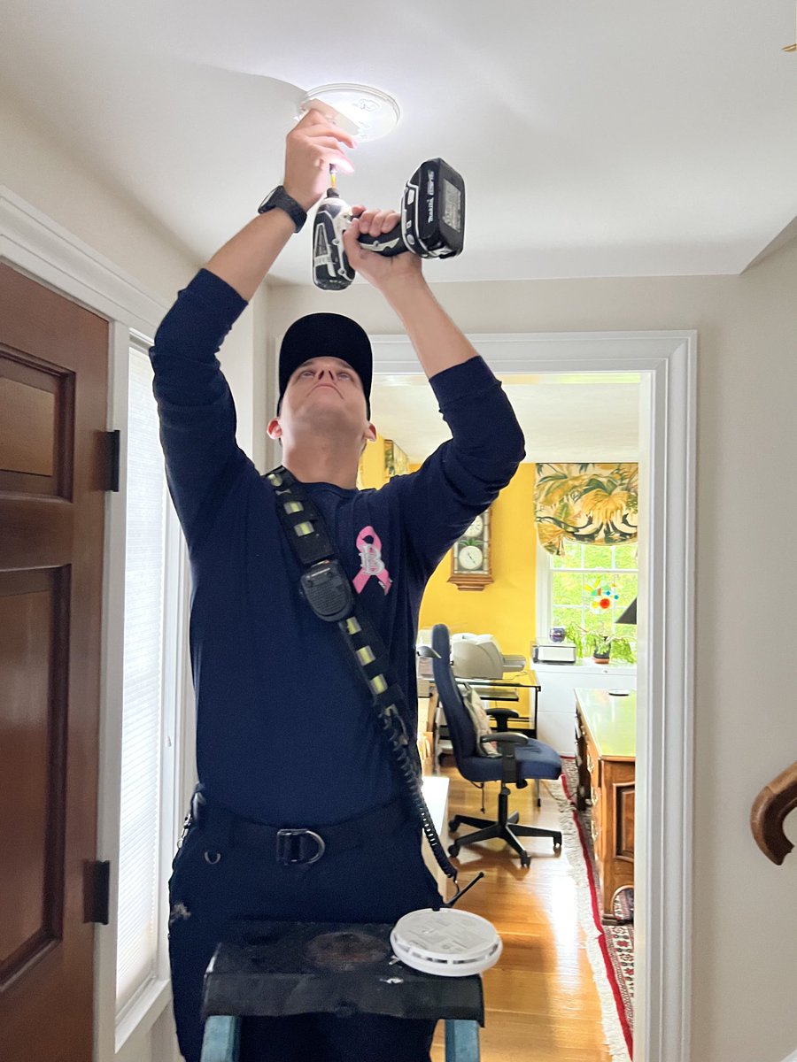 BurlingtonMAFD's tweet photo. Firefighter Zachary Rolfe installing a smoke detector today in a local residence as part of the Burlington Fire Department and Council on Aging’s senior smoke detector installation program. https://t.co/tQjERHuiqw