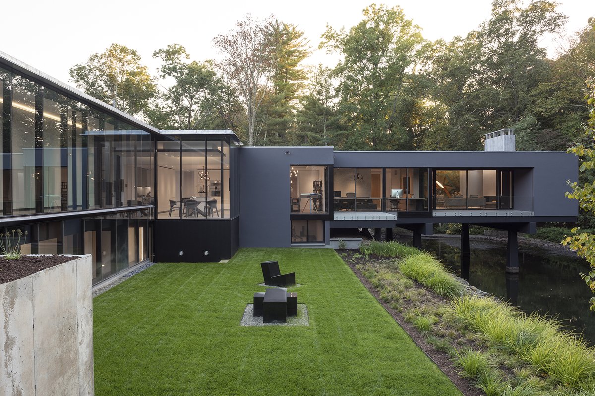 CONTEMPORARY DESIGN IN A RUSTIC SETTING. The architects of this home in Greenwich, CT wanted to capture the natural surroundings from all angles when designing this home. Solar Innovations provided all of the fenestration systems.  Contact a sales representative to learn more.