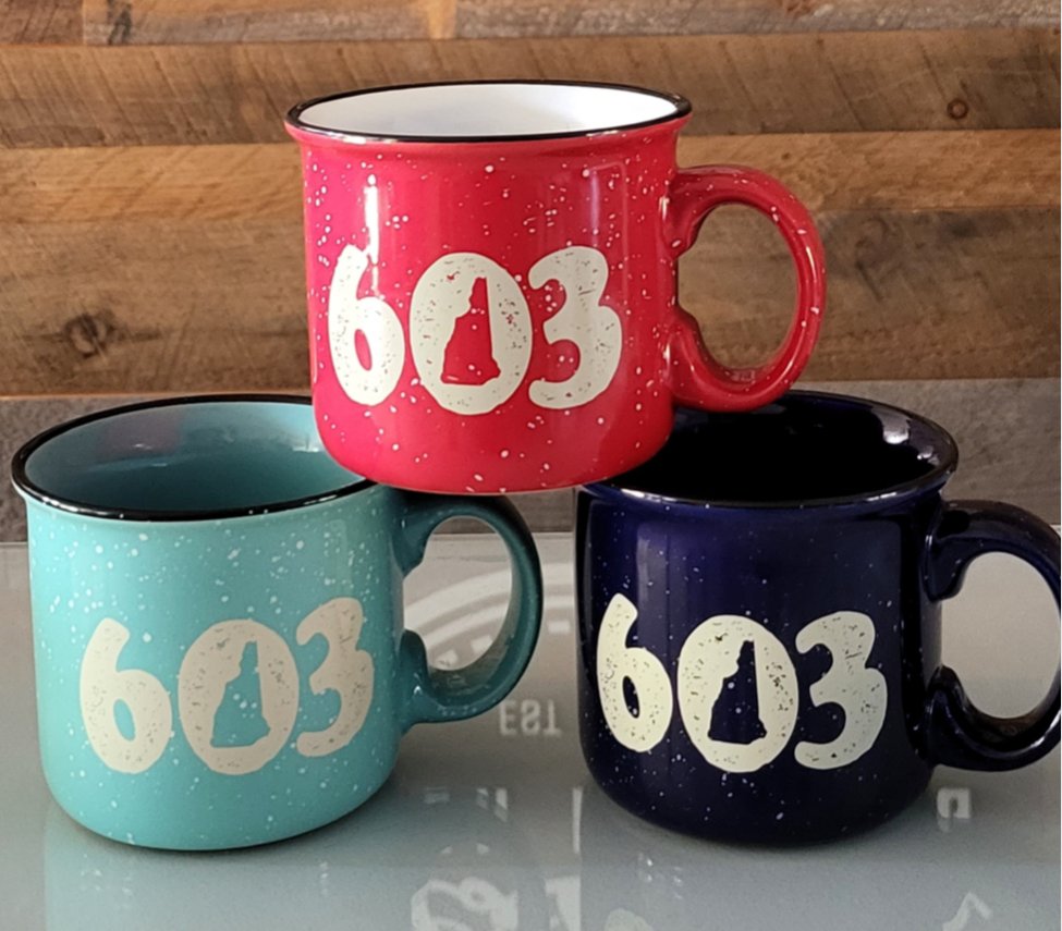 New Mug Alert! 

Head to the great outdoors with this 603 Camper mug! The sturdy ceramic construction of this 14 oz. camper-friendly mug features a retro granite design. Its unique design has a speckled glaze and a black halo around the rim. 

Available in both of our stores!