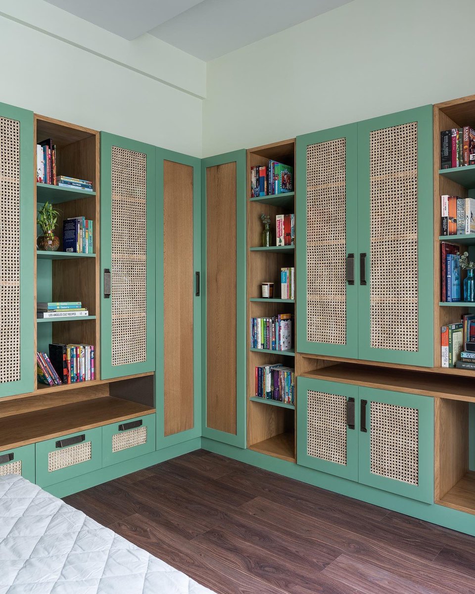 Breathing books!!
Every book comes to life in the hand of its reader. This library has a book shelf with a Rattan(Cane) panel shutter. 
The beauty of the shutter is in its dynamic nature, depending on the weather the panel slightly changes form and comes to life!!