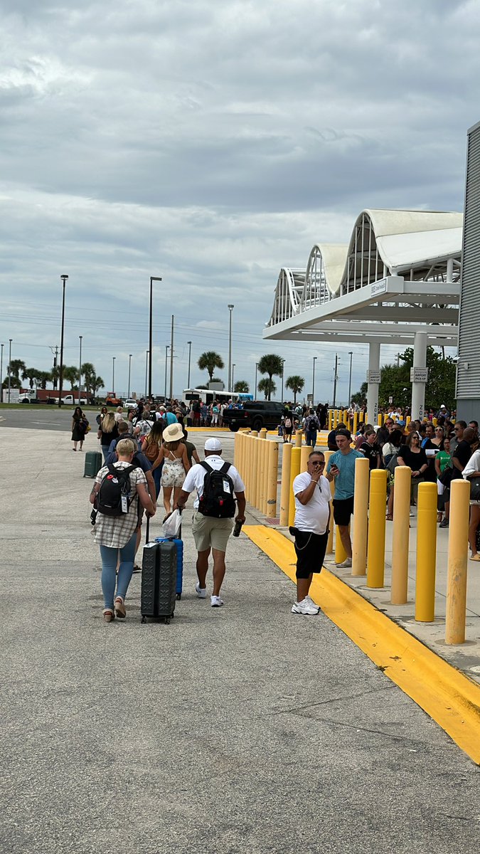 KirkLundell's tweet photo. Waiting line to board @MSCCruisesUSA Meraviglia. Line to get in terminal goes as far as the eye can see. No sorting of boarding times until inside, which means people who show up at the right time have to wait with everyone else. https://t.co/twCHdBPr6r
