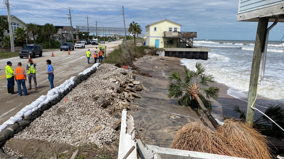 JaxStrong's tweet photo. As part of its Coastal Storm Risk Management mission, JaxStrong engineers assess beaches after Hurricane Ian. Water breached the dune at the Vilano Beach in St. Johns County, but A1A remained intact. @MyFDOT placed stone and sandbags to protect the road. #Ian #HurricaneIan https://t.co/AHAqS9mApI