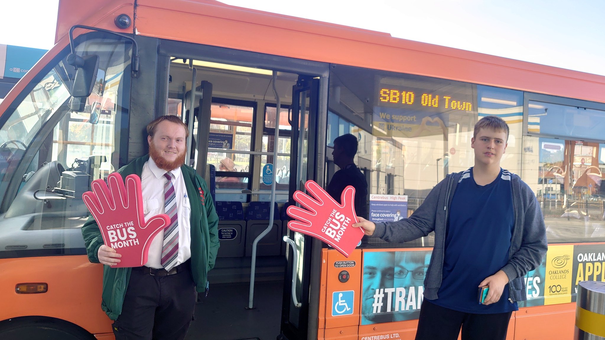team from centrebus sporting giant red hands