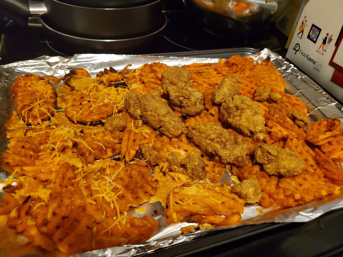 phantombatman's tweet photo. Sweet potato fries with cheese on half of them and chicken strips. #PugFamKitchen #PugFam https://t.co/thpiFs1F1J