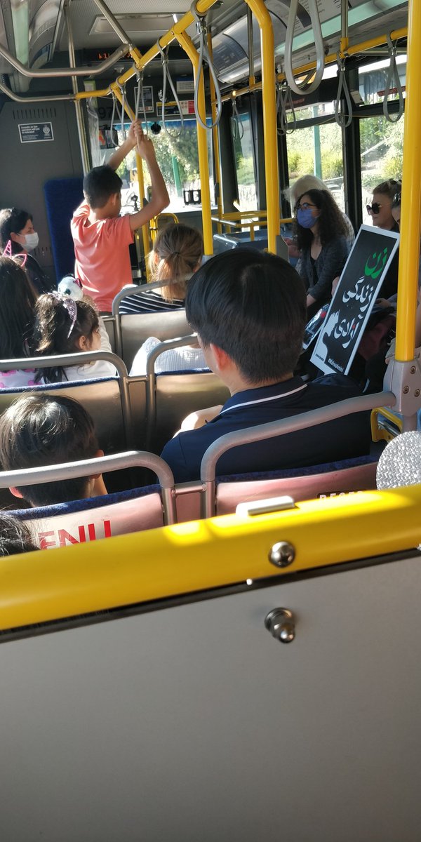 Kasra_Ha's tweet photo. Meanwhile on the bus...I think pretty much all of us are heading to the #Vancouver human chain for the #MahsaAmini protest. 

#مهساامینی 
#زن_زندگی_آزادی 
#Woman_Life_Freedom https://t.co/HrAA8qmijZ