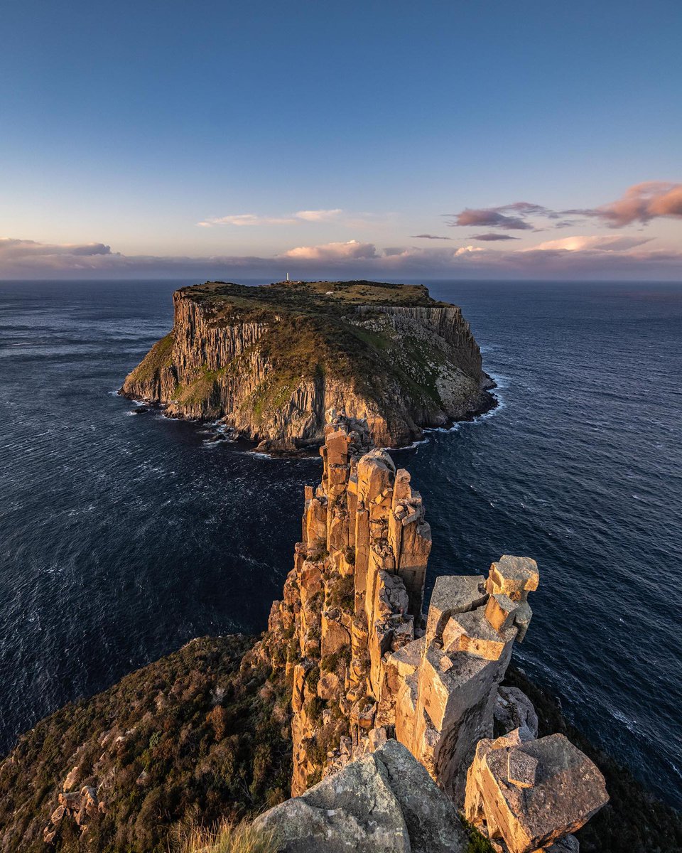 Mighty stacks of dolerite taper away towards Tasman Island – it doesn’t get more rugged than this. 📍Cape Pillar, Tasman National Park, Hobart & Beyond  📷 IG/shotbymurray #DiscoverTasmania