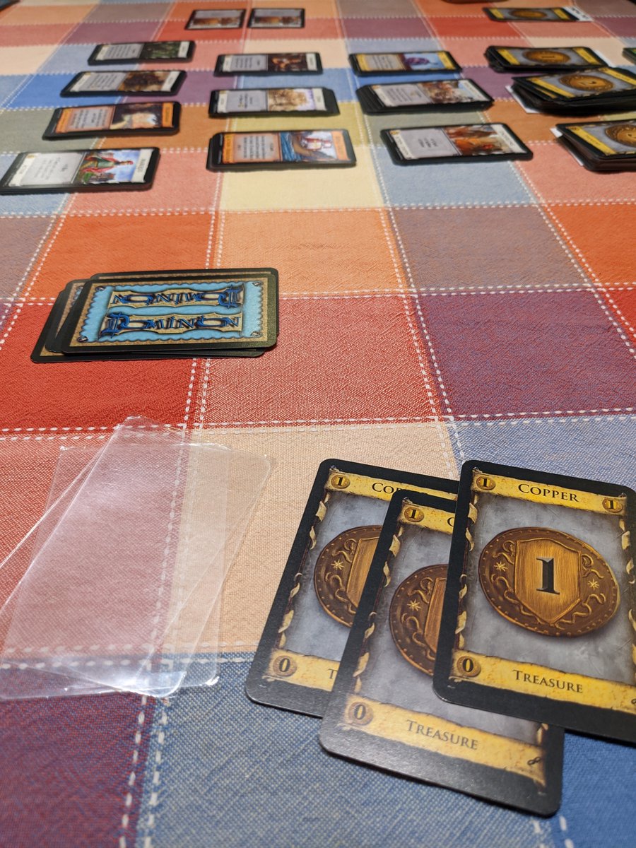 De-sleeving Dominion cards while playing the latest Dominion expansion.