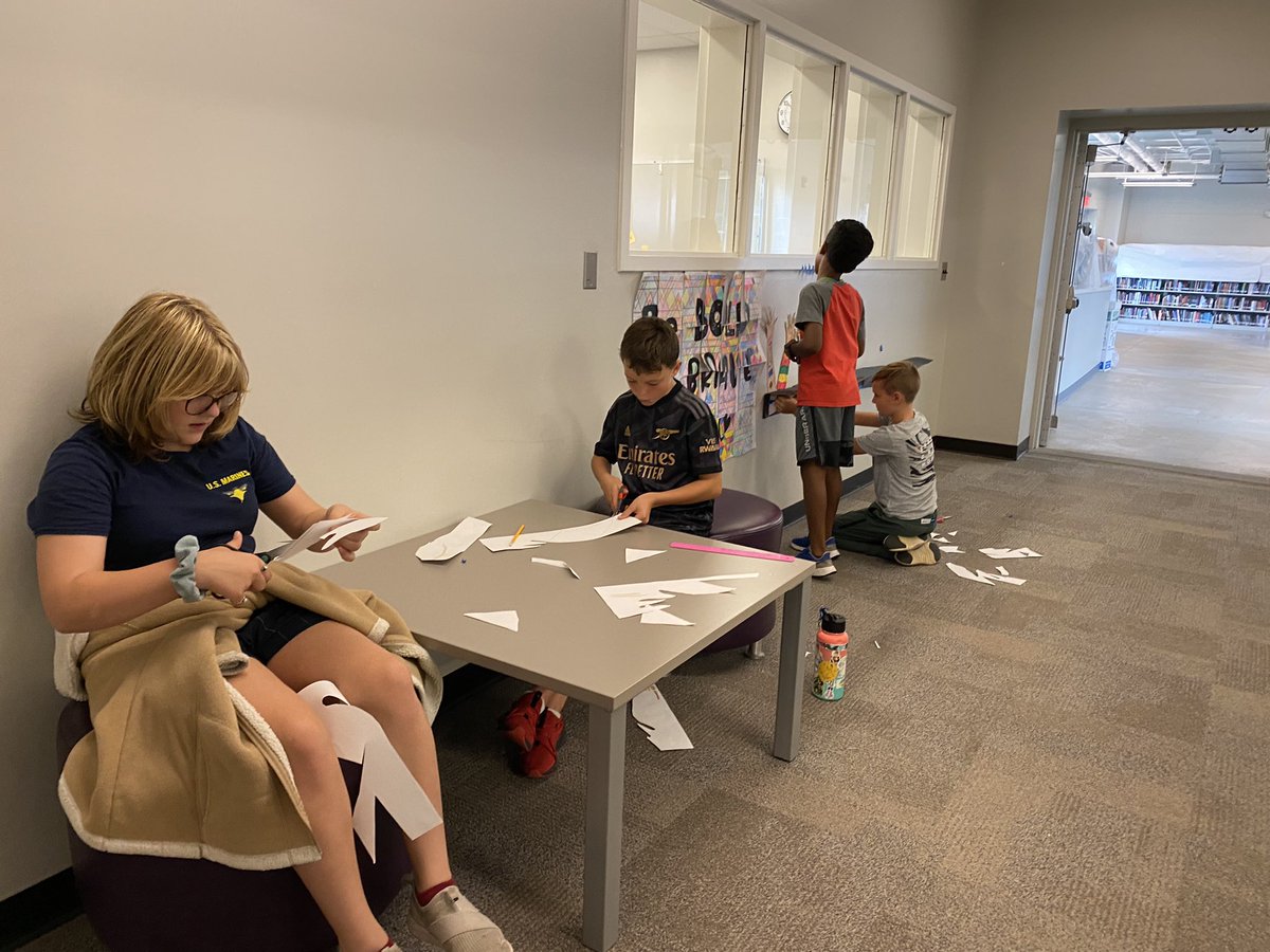 MphSteam's tweet image. Last week students created hands with visuals expressions of themselves and their passions. A few students took ownership of the display and constructed 3d “tables” to display their work.