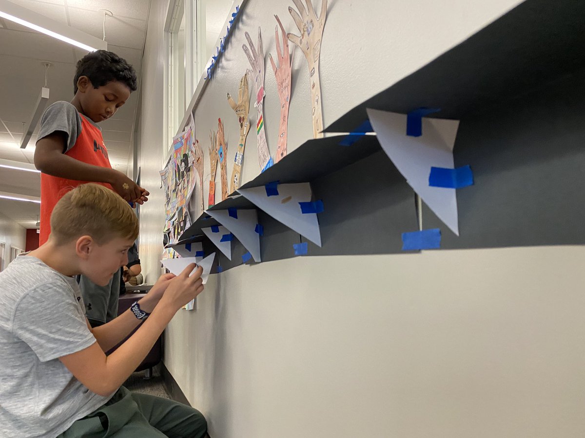 MphSteam's tweet image. Last week students created hands with visuals expressions of themselves and their passions. A few students took ownership of the display and constructed 3d “tables” to display their work.