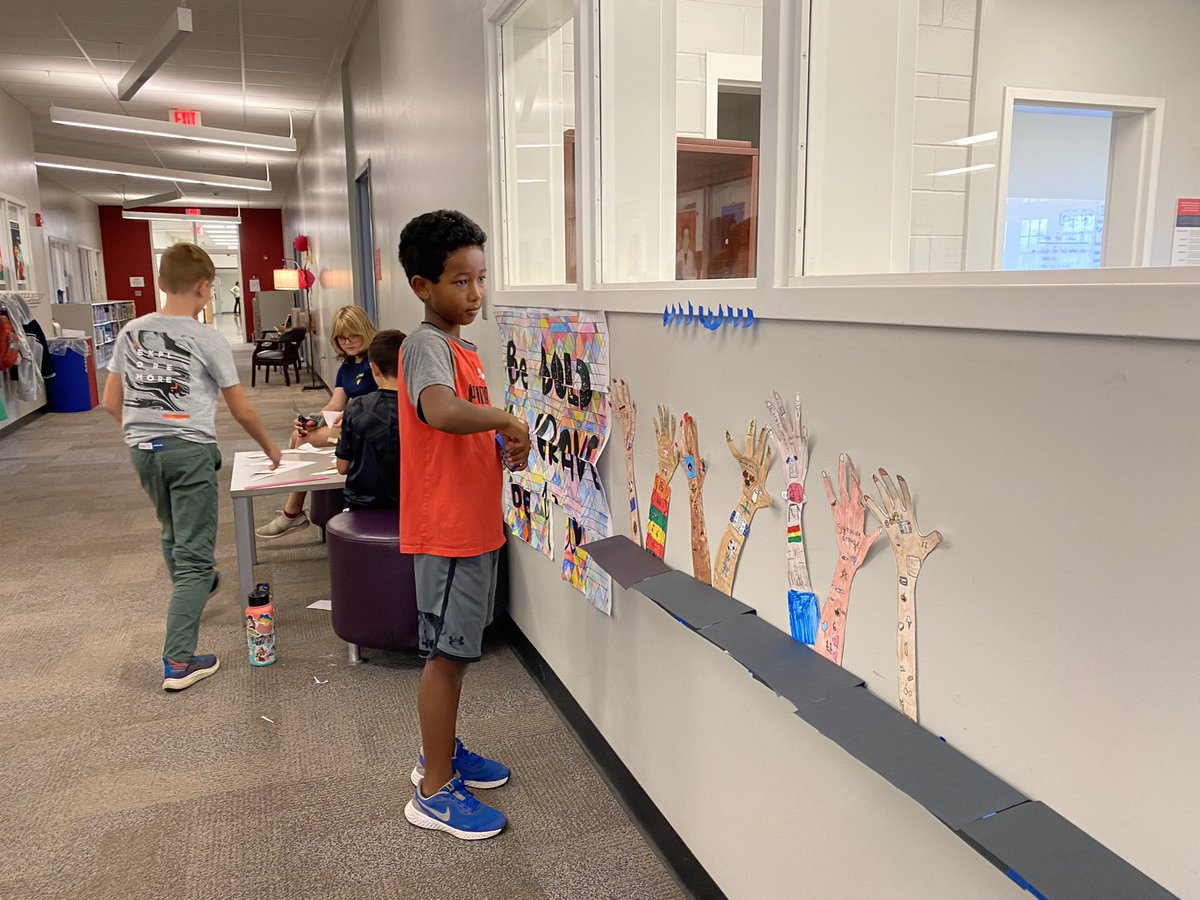 MphSteam's tweet image. Last week students created hands with visuals expressions of themselves and their passions. A few students took ownership of the display and constructed 3d “tables” to display their work.