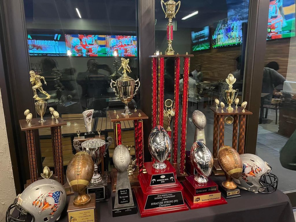 Syracuse1848's tweet photo. A full trophy case for @StrongSyracuse. More honors for on Monday at #Syracuse City Hall. Mayor Walsh will proclaim Syracuse Strong Day celebrating the one month anniversary of the team’s second national championship. Join us at 2 pm on City Hall steps. #cusestrong https://t.co/YvCmKM0blR