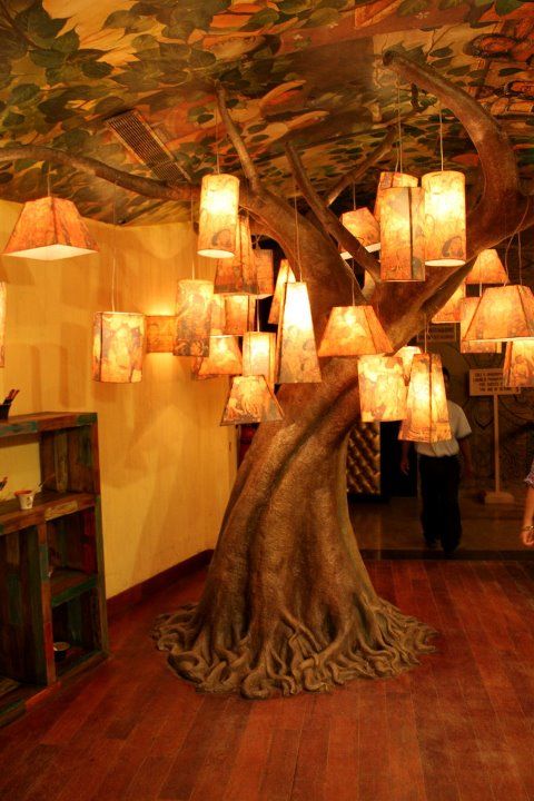 ElliottBlackwe3's tweet photo. I love that someone thought: Yeah, I could just install an ordinary lamp OR I could install a beautiful tree of lights instead... And that they did. https://t.co/VMaZuh2Bau