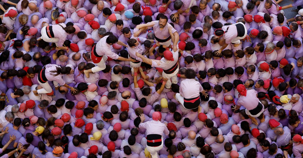 Reuters's tweet photo. Catalans compete to build the biggest human towers in Spain https://t.co/zgsn2OUxkR https://t.co/2kncpFCRX4