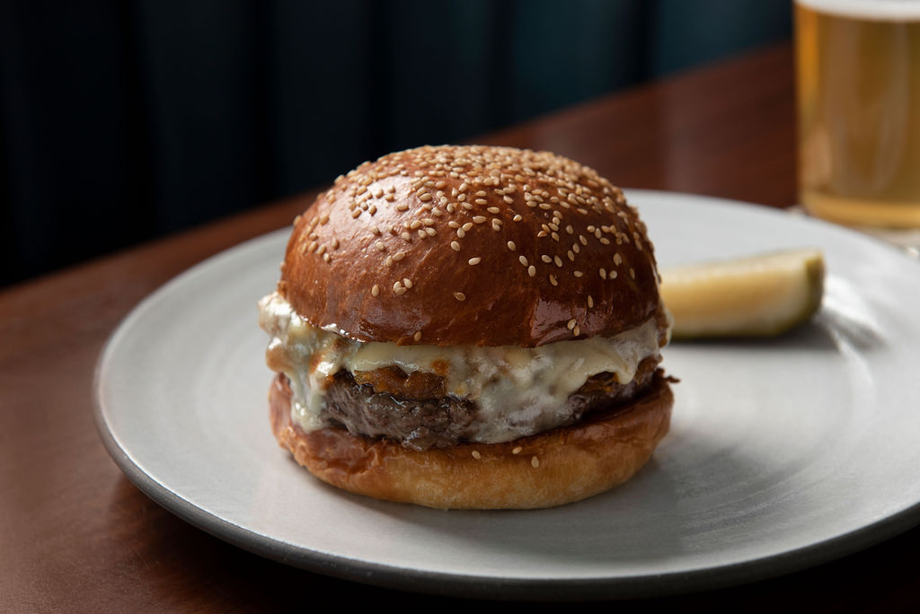Your new favorite burger, only at the bar. 
.
Dry aged beef, koji onions, cooper sharp and a seeded bun