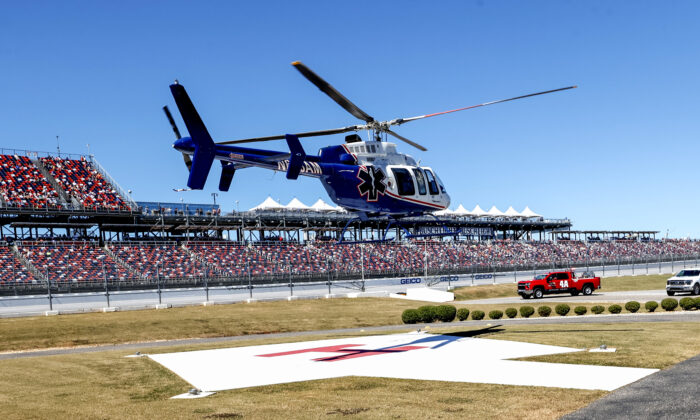 Driver Jordan Anderson airlifted by a helicopter to a local hospital after a fiery crash during the NASCAR Trucks Chevrolet Silverado 250 auto race in Talladega, Ala., on Oct. 1, 2022. (Butch Dill/AP Photo)TALLADEGA, Ala.—NASCAR  # # # # # # #

https://t.co/Hu7oQBtiia https://t.co/kiqASNQyIP