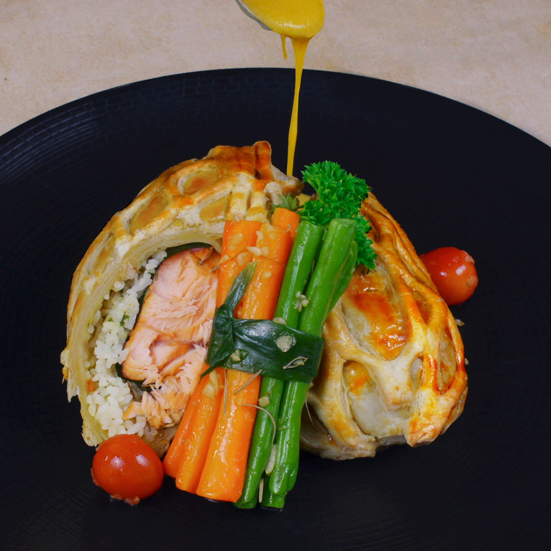 Relish the taste of our special menu of the month "Salmon Coulibiac" baked of salmon in puff pastry with feeling butter seaweed rice, served with glazed string bean and lemon butter sauce. That will feast your eyes and indulge your taste buds. A must try!