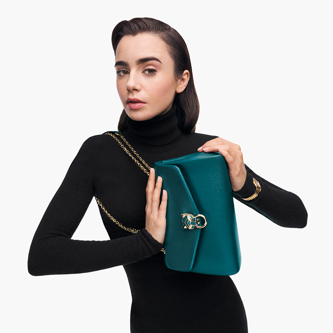 Cartier's tweet photo. This is not just a bag, it’s an attitude. @lilycollins makes a style statement in the new Panthère de Cartier bag. #PanthèredeCartier 
https://t.co/Aa9iwvk9mz https://t.co/j8ZaZTqHTS