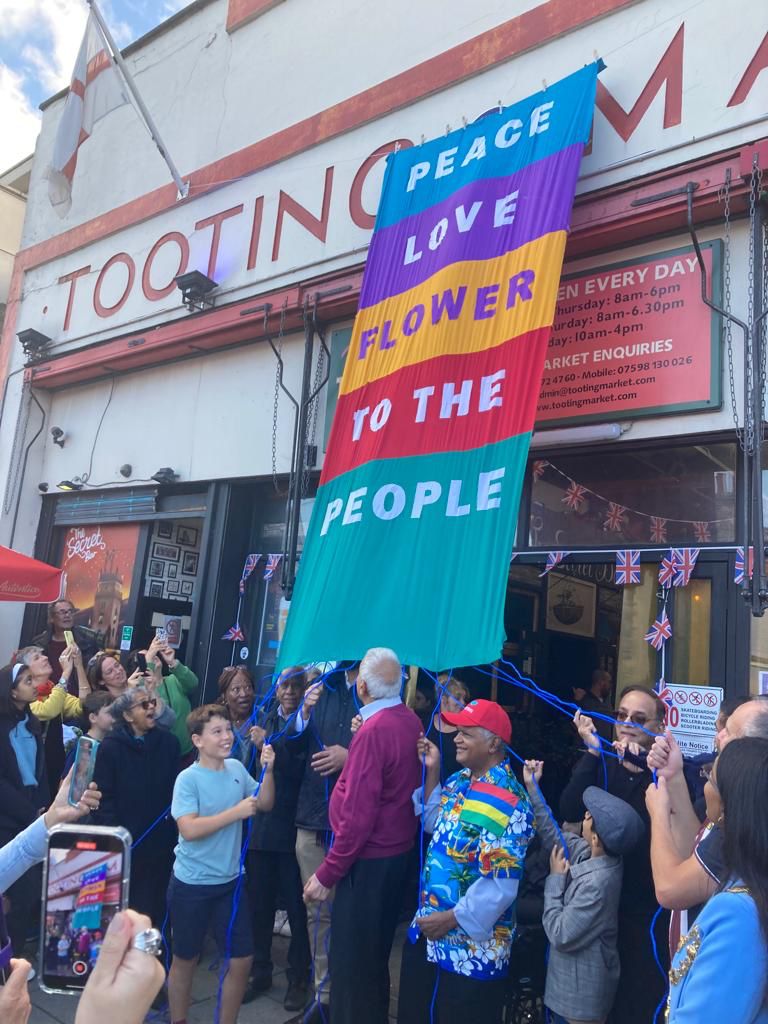 WandsworthMayor's tweet photo. Historic day in Tooting where the contributions of migrants has been recognised with a blue plaque unveiling at Tooting Market! Thank you Geoff Simmons @summerstown182 for your important work. We are Tooting! https://t.co/7kZkMxi2Uq