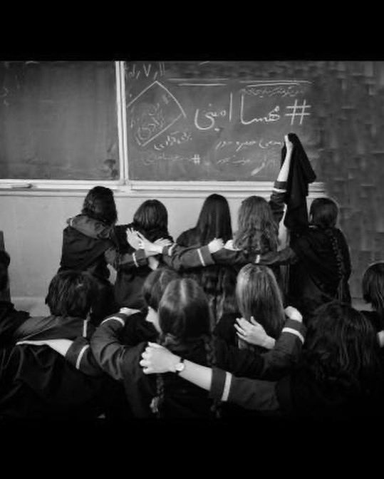 Iranian schoolgirls post without head coverings in front of #MahsaAmini