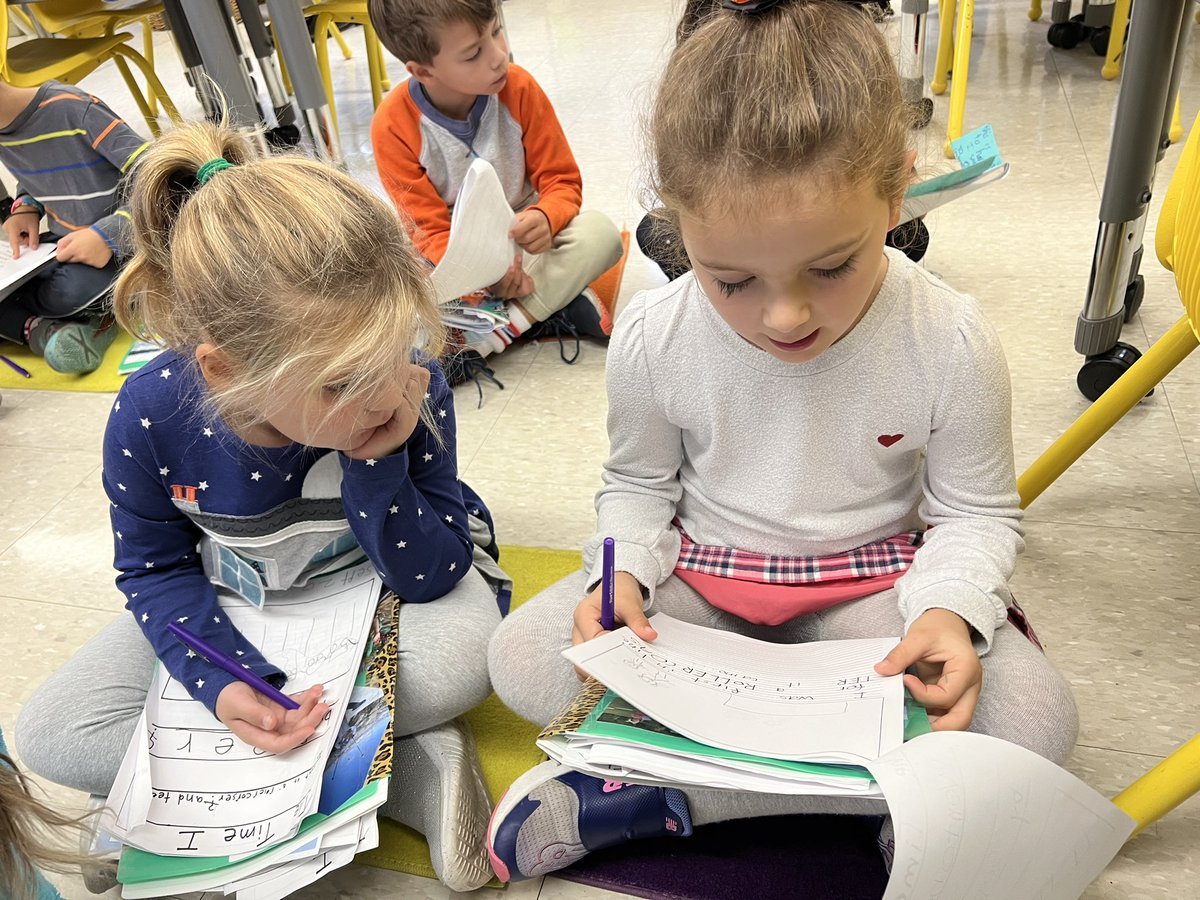 Writing partners helping each other revise by getting feedback.