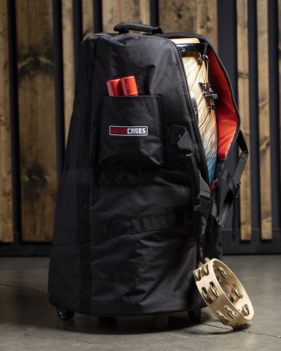 guitarcenter's tweet photo. Get in the groove with the @gatorcases Padded Conga Bag with Wheels and Red Interior! With a reinforced bottom, a comfortable shoulder strap and a handy pocket for your hand percussion, getting to the gig has never been easier.

Order yours: https://t.co/BYIuEKaBXS https://t.co/nTakv7ldke