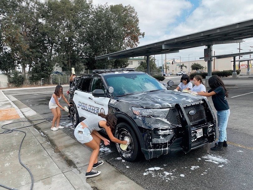 WestminsterPDCA's tweet photo. Over the weekend, Warner Middle School held a car wash for their cheer squad. Officer Foland and Officer Mora were happy to stop by to show their support for these amazing students! ๐ #WPD47 https://t.co/lExzShIP15