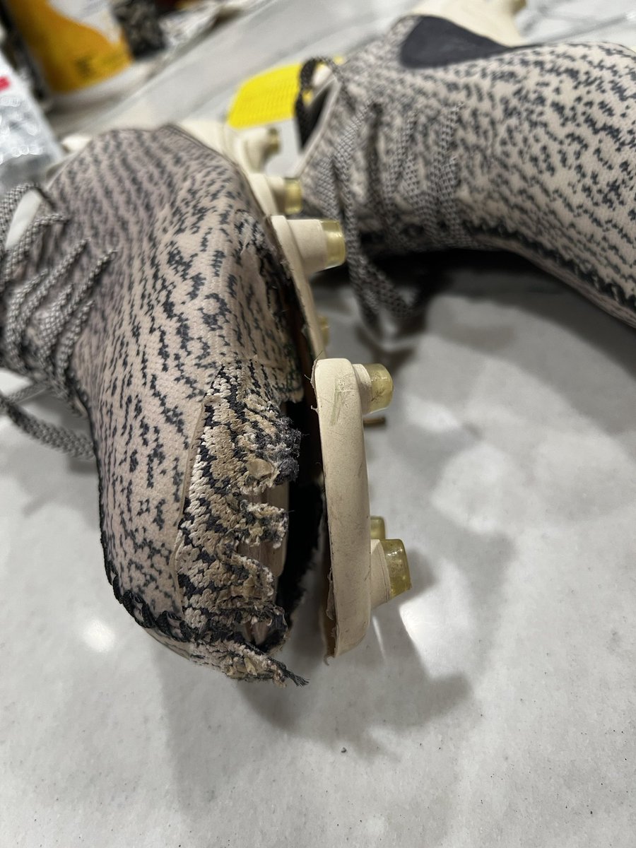 charityheim7's tweet photo. First time to wear these Adidas YZY cleats and they fall apart! Reached out to Adidas and they refused to stand behind them to even replace them for the exact cleat! Only buy these if you DON’T play football! $200 cleats useless!! 😡😳 https://t.co/Oeh6YYou57