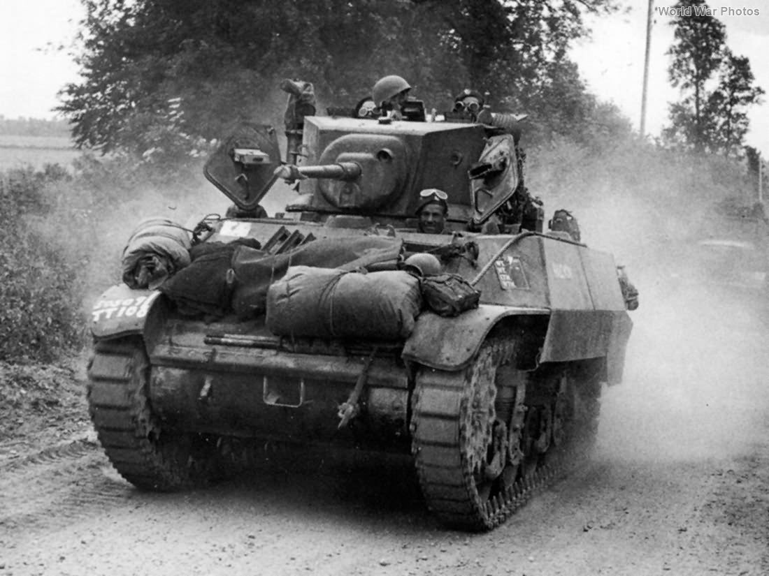 lomas_sean's tweet photo. @RedFiveModels @WeHaveWaysPod @almurray @James1940 3/2, sorry this is all a bit Spanish Inquisition 🤣. Photos below to add to confusion. 1 - postwar SRY parade, tank allegedly called Issum. 2 - a Stuart V in Normandy (not SRY but to illustrate use) and 3 - pic from James’ book. Note the sloping armour and flat engine deck. https://t.co/cDJ2rBd7Un