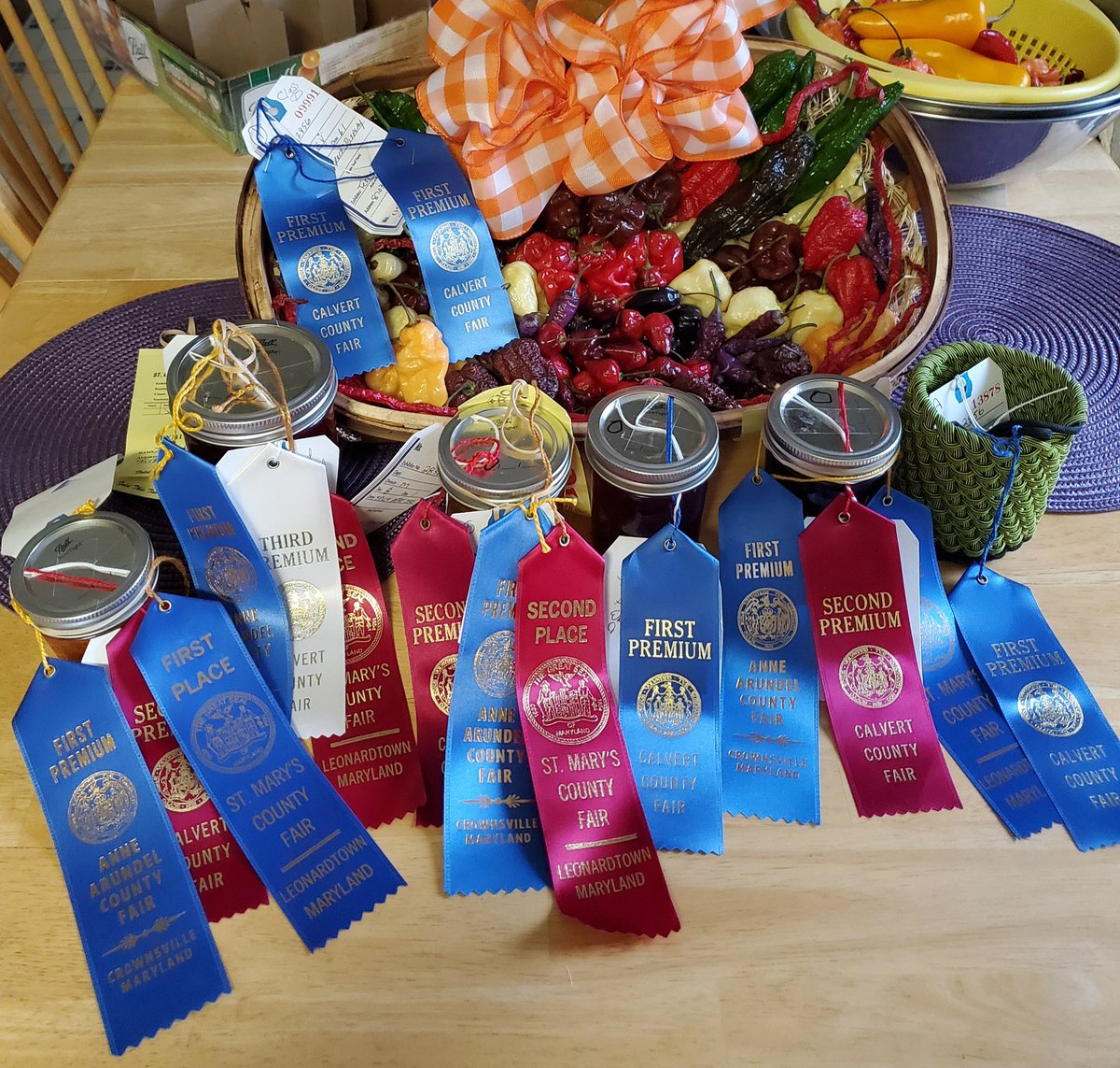 trapper831's tweet photo. #countyfair season is finally over for me. #peppers #pepper display
#hotsauce #spicyapplejelly #spicyblackberryjam #pickledbeets #muscadinepassionfruitjelly with #purple bubblegum peppers https://t.co/msr334HjuS