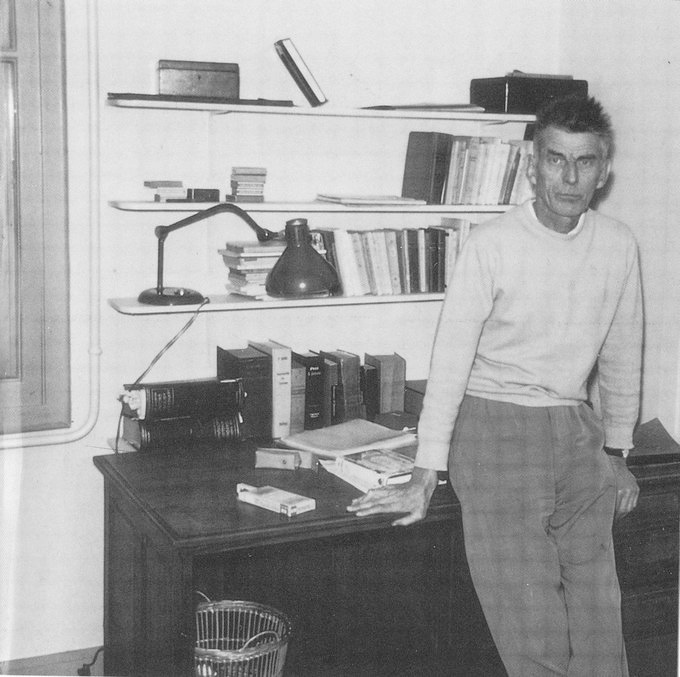 Samuel Beckett at his writing desk in Ussy, c.1965. Photograph: Dartmouth College.