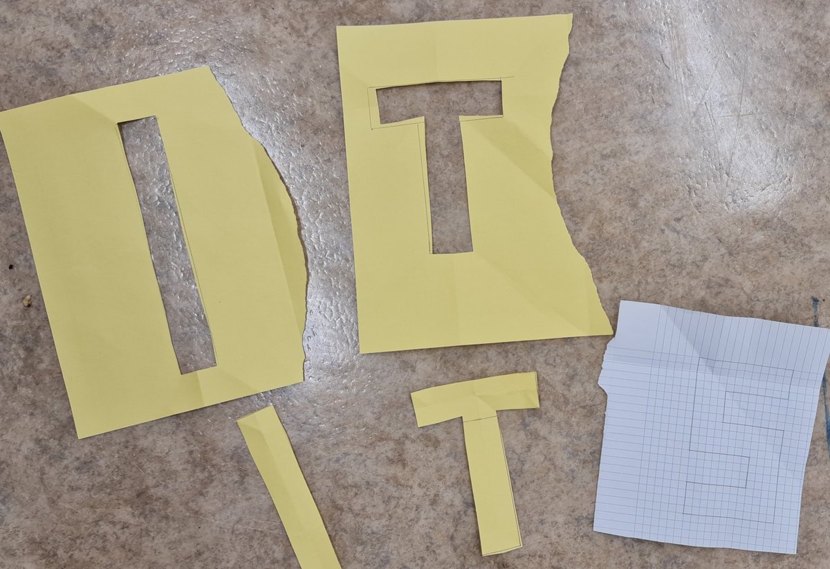 At our maths enrichment club, Lions of Symmetry, we tried out the single-cut letter cutting chellenge by <a href="/stecks/">Katie Steckles</a>. I want to try an S next so I'm using squared paper and I drew it on both sides to start with. 
youtu.be/GKzl0_6NKJ8