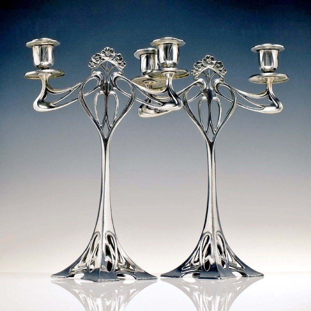 Pair of Art Nouveau silver plated candle sticks from c. 1906 by sculptor and designer Albert Mayer for WMF, Germany.