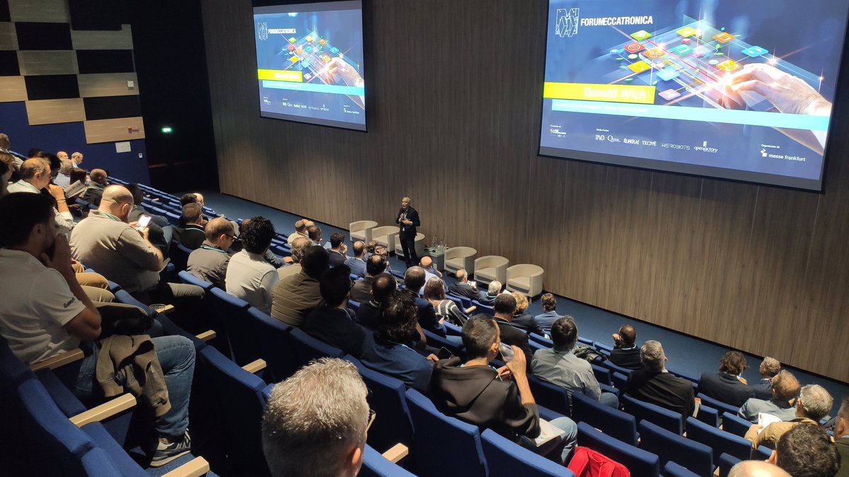 meccatronica's tweet photo. È iniziata la nona edizione di Forum #Meccatronica. Sul palco Donald Wich di @messefrankita e Andrea Bianchi di @ANIEAutomazione per l apertura lavori. https://t.co/P6FSC2BD0k