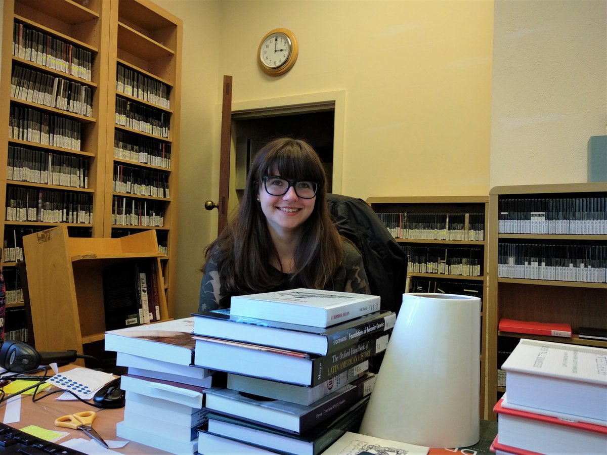 caiuslib's tweet photo. Hannah has been on a mission to work in *all* the beautiful libraries, and Caius is definitely beautiful! You can find her in the office, behind a pile of new books, working with Neil to catalogue them so that you can find them on iDiscover and on the shelf. #MeetTheLibraryTeam https://t.co/xEiy4QcCtk