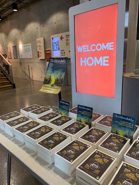 ChildrensBkShow's tweet photo. @DanielMorden3 before his mysterious and enchanting performance at @HOME_mcr 

Look at the stacks of books ('Secret Tales from Wales') waiting to be handed out to every child at the end!⚔️ https://t.co/NPDrWLxlRP