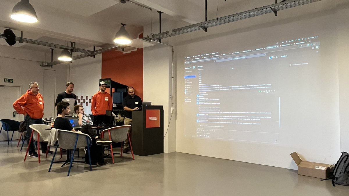 maria_alcantara's tweet photo. Behind schedule team, their project does it all: helps you decide on the #camundacon talk to see, sends you an email with the information + a cocktail recipe by bot @NiallDeehan 🤖
#hackday #camunda 
@tmpaiva55 @rnschk @asys3 Thorben Heinz https://t.co/KbGXAQQWWv