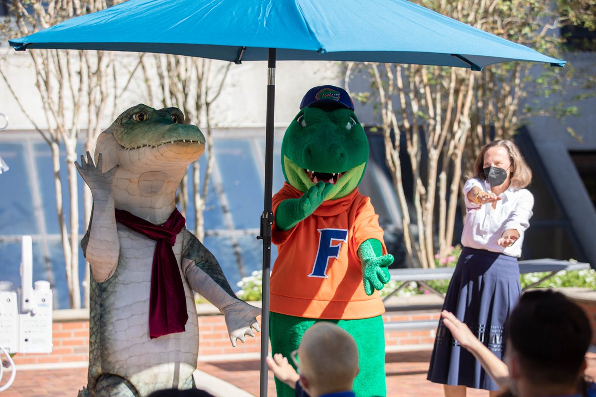 UF's tweet photo. Florida: The only place on Earth where crocodiles and alligators coexist 🐊

Beloved reptiles @LyleCrocodile and @AlbertGator joined @PresidentFuchs and Mrs. Fuchs at the @UFHealth Children's Hospital today to spread joy to our pediatric patients. 🧡💙 https://t.co/RnsEvmJ2oH