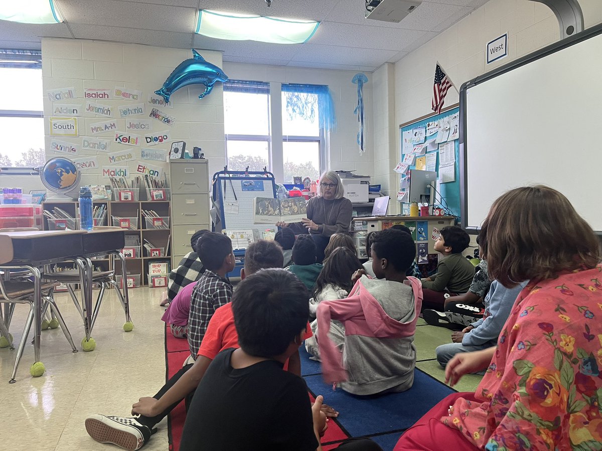 2nd graders enjoying their spirit week participation prize with Ms. Casper!