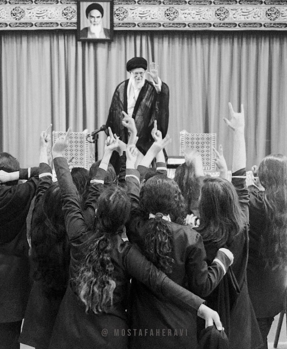 Visual artist <a href="/mostafaheravi/">mostafa heravi</a> has combined a photo of the brave school girls in Iran giving the finger to Khomeini’s photo with a photo of the Supreme Leader. 

Absolutely perfect. 

#MahsaAmini #ZhinaAmini