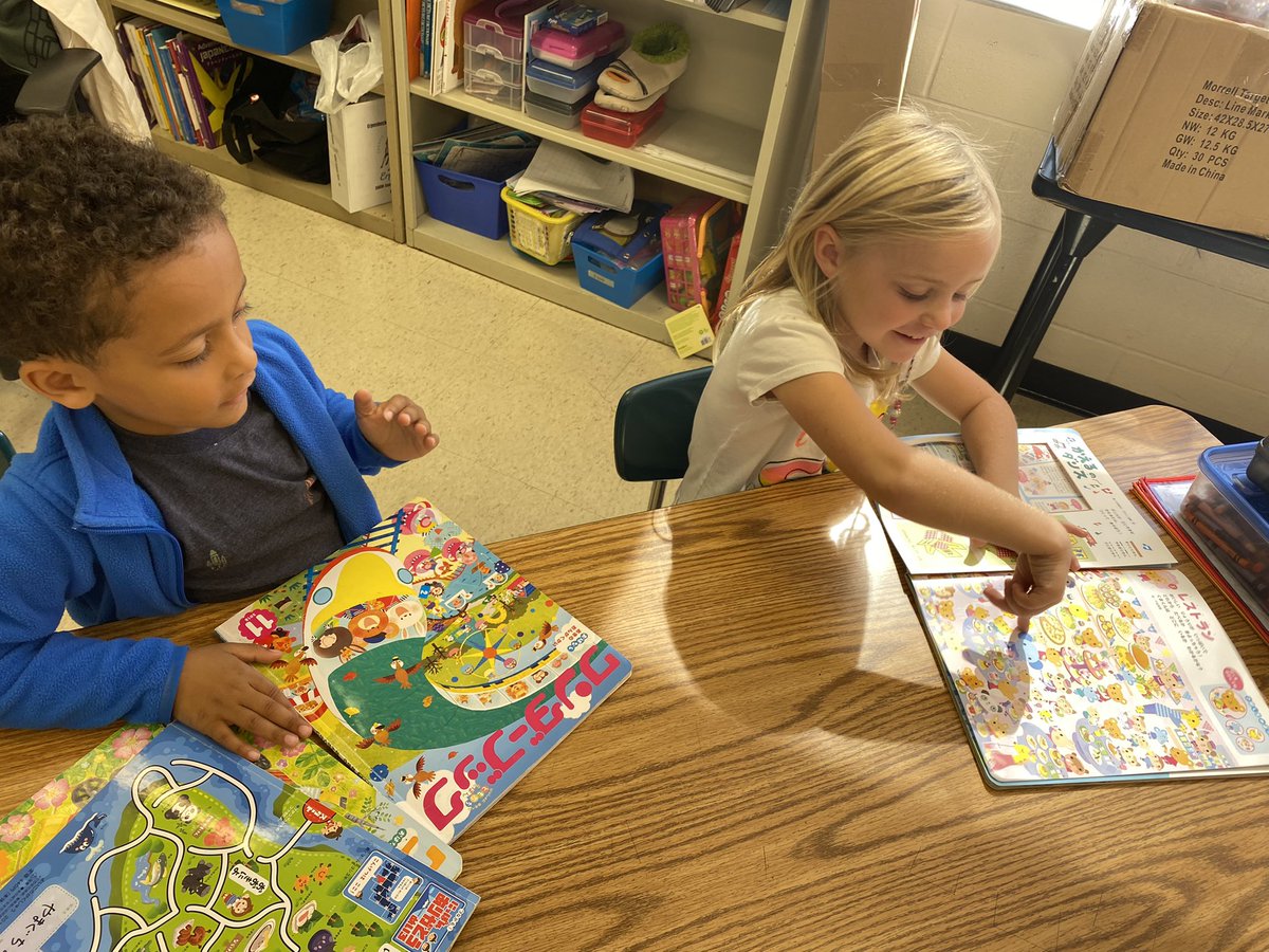 frysensei's tweet photo. Kinders get to explore some Japanese books! Isn’t it cool how Japanese writing can go from top to bottom or from side to side? Even on the same page?! And the books open backwards from ours! 🤩 @richardskclass @EES_Mustangs https://t.co/ytwwlARlkX